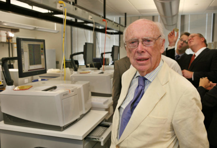 FILE PHOTO: Watson, co-discoverer of the DNA helix and father of the Human Genome Project, stands inside a laboratory at the Baylor College of Medicine's Human Genome Sequencing Center in Houston